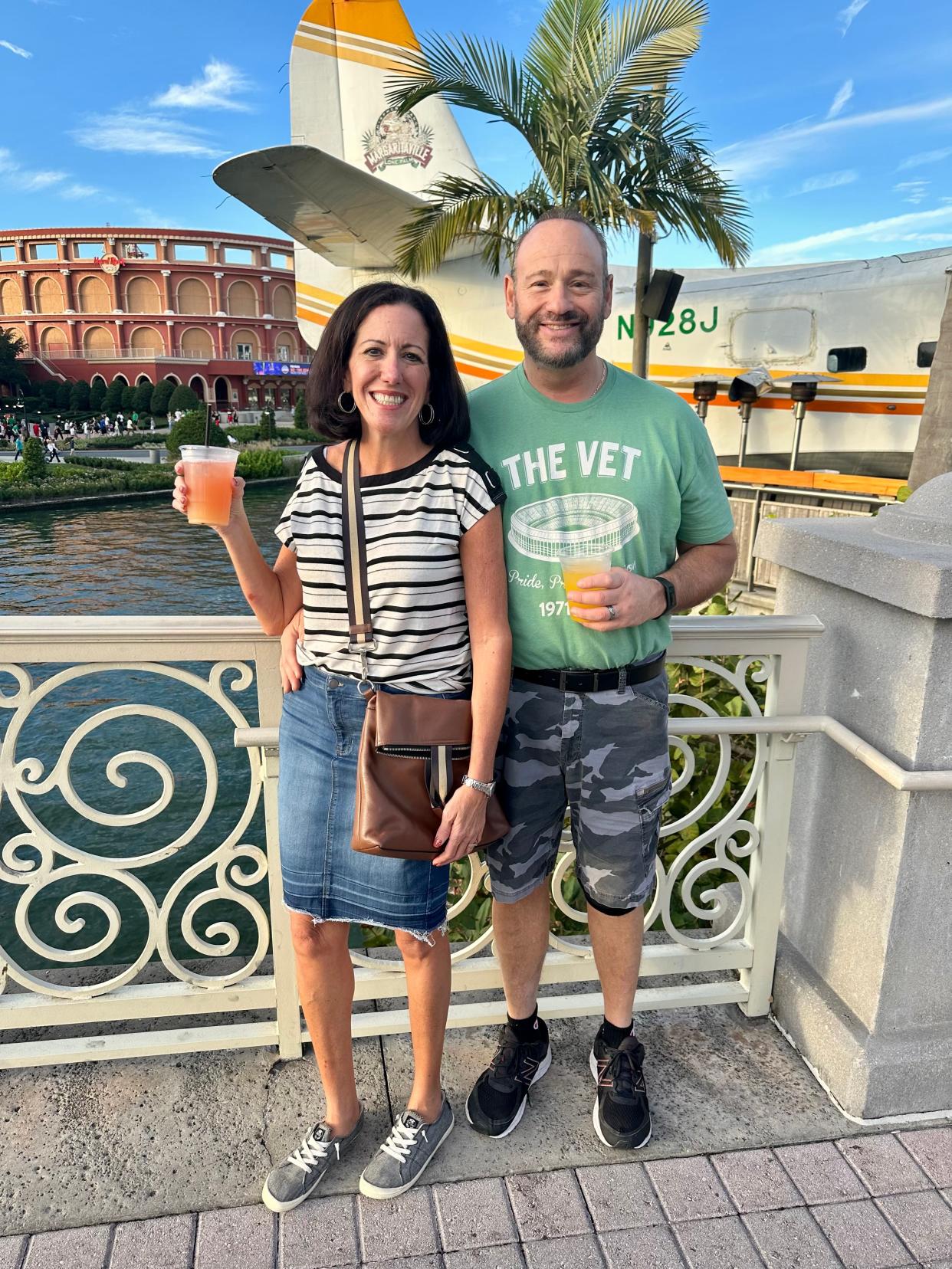 Monica Simon Perella and her husband Anthony enjoy drinks and sunshine at Universal Studios in Orlando Christmas week, 2023. Perella said her family moved to Florida's east coast for warm weather year-round.