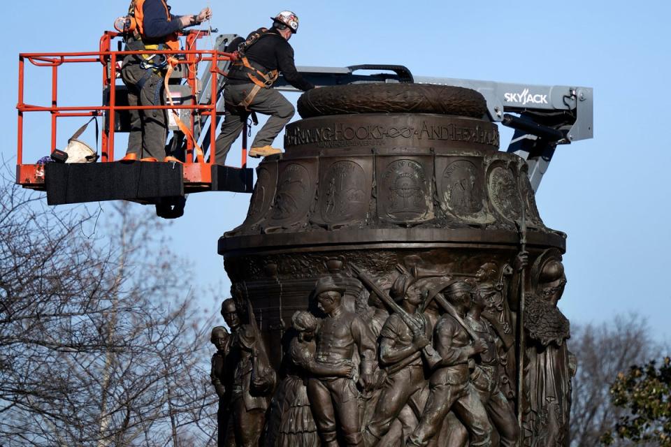 Workers dismantle the Confederate Memorial at Arlington National Cemetery December 20, 2023, in Arlington, Virginia (AFP via Getty Images)
