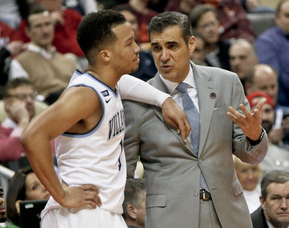 Villanova’s Jalen Brunson, left, leans on coach Jay Wright during a timeout during the second half of an NCAA men’s college basketball tournament first-round game against Radford, Thursday, March 15, 2018, in Pittsburgh. Villanova won 87-61. (AP Photo/Keith Srakocic)