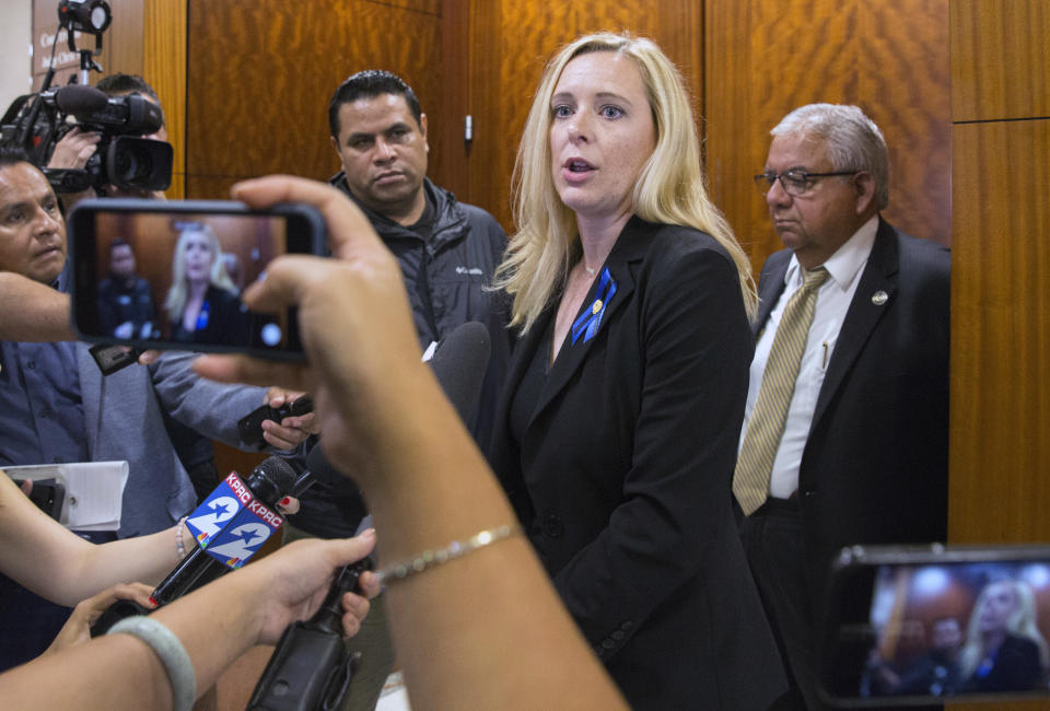 Harris County District Attorney's Office special crimes prosecutor Katie Warren speaks to the press regarding to Robert Solis' capital murder of a police officer case on Monday, Sept. 30, 2019, in Houston. Solis, 47, who is accused in the shooting death of Harris County Deputy Sandeep Dhaliwal, appeared to Judge Chris Morton at the Harris County Criminal Courthouse. (Yi-Chin Lee/Houston Chronicle via AP)