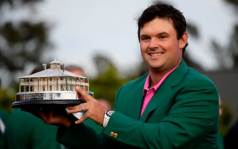 Patrick Reed holds the championship trophy after winning the Masters golf tournament Sunday, April 8, 2018, in Augusta, Ga - Credit: AP