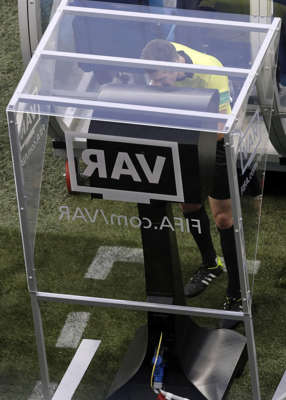 <p>Referee Matt Conger from New Zealand watches the Video Assistant Referee system </p>