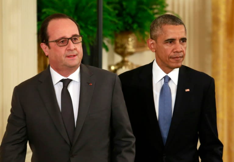 US President Barack Obama (R) and French President Francois Hollande arrive for a joint news conference after their meeting at the White House in Washington on November 24, 2015