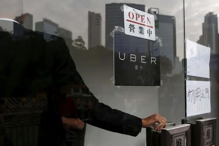 FILE PHOTO - An open sign is seen at the office of taxi-hailing service Uber Inc during a driver recruitment event in Hong Kong, China December 29, 2015. REUTERS/Tyrone Siu/File Photo