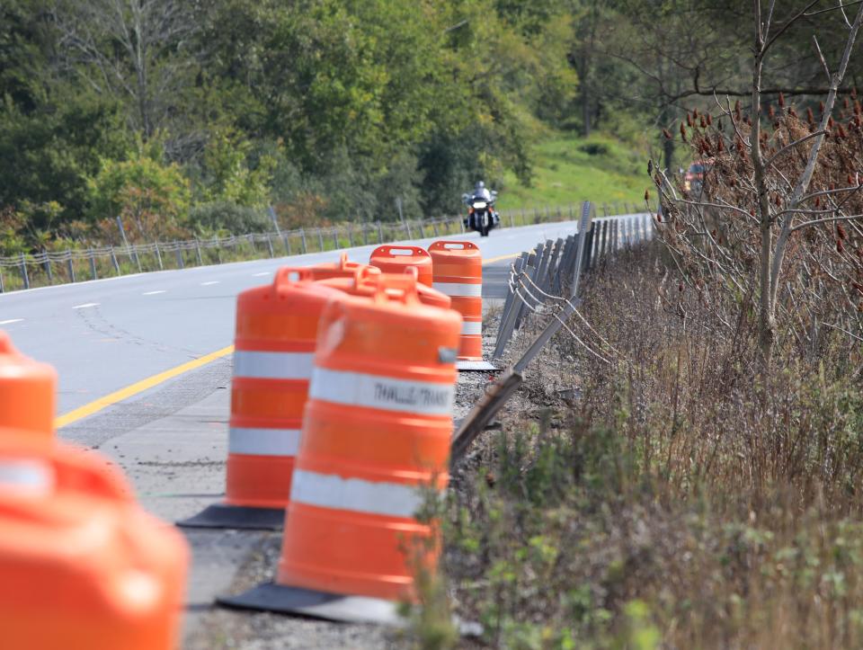 Twisted cable barriers and construction barrels mark the location on Interstate 84 in Slate Hill near where a bus lost control and rolled down the median causing 2 fatalities on Thursday. The NTSB will hold a press conference later on Friday Sept. 22, 2023 with their findings.