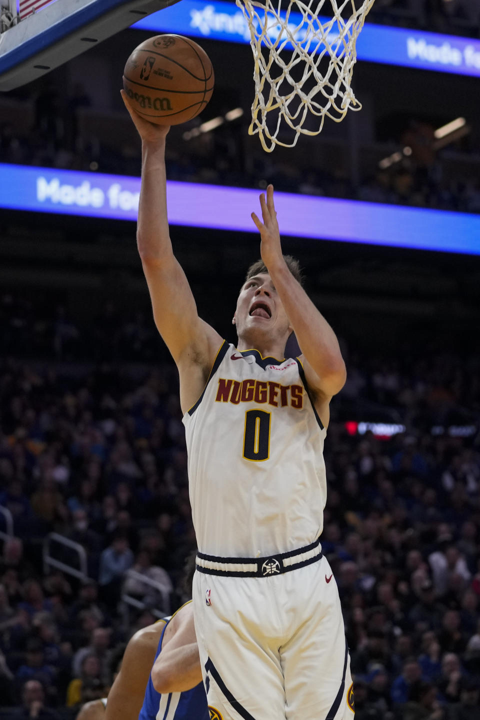 Denver Nuggets guard Christian Braun shoots during the first half of an NBA basketball game against the Golden State Warriors, Sunday, Feb. 25, 2024, in San Francisco. (AP Photo/Godofredo A. Vásquez)