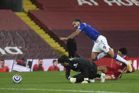Liverpool's Trent Alexander-Arnold, (66) right, fouls Everton's Dominic Calvert-Lewin, for a penalty from which Everton's Gylfi Sigurdsson scored his sides second goal of the game during the English Premier League soccer match between Liverpool and Everton at Anfield in Liverpool, England, Saturday, Feb. 20, 2021. (Phil Noble/ Pool via AP)(Lawrence Griffiths/ Pool via AP)