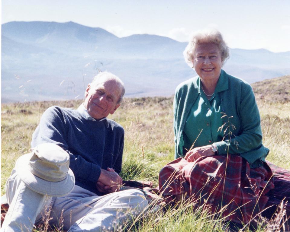 <p>The royals are pictured relaxing at Coyles of Muick, a beauty spot near the town of Ballater in Aberdeenshire</p> (PA)