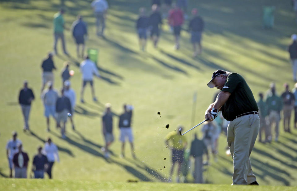 Craig Stadler hits off the first fairway during the first round of the Masters golf tournament Thursday, April 10, 2014, in Augusta, Ga. (AP Photo/Charlie Riedel)