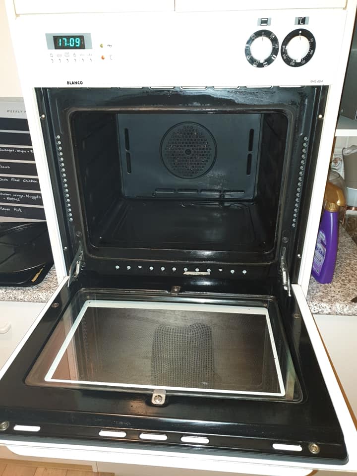 A photo of a clean oven.