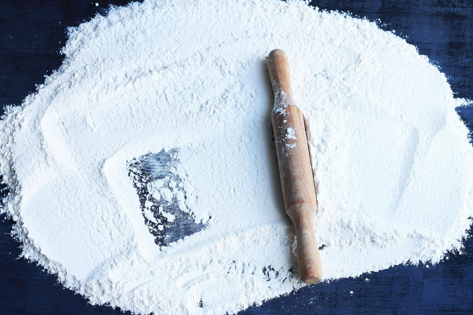 a rolling pin on white flour