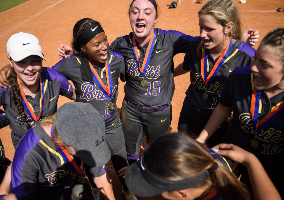 Carlie Myrtle (15) celebrates Jack Britt's 2018 4-A softball state championship with teammates after defeated South Caldwell at NC State's Dail Stadium.