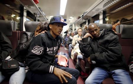 Dejen Asefaw (2nd L), a 24-year-old Eritrean, travels by train with his girlfriend from Bolzano to Brenner, northern Italy, May 28, 2015. REUTERS/Stefano Rellandini