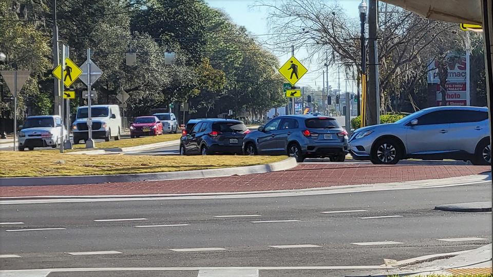 Traffic backs up Feb. 10, 2022, after a minor rear-end crash in the new Turbo Roundabout, occurring as JTA officials joined others officially opening the new road system in Florida near Jacksonville University.