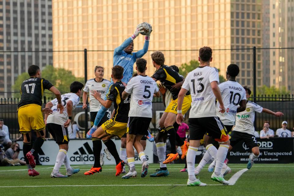 Pittsburgh Riverhounds goalkeeper Jahmali Waite makes a save against the Crew on Wednesday.