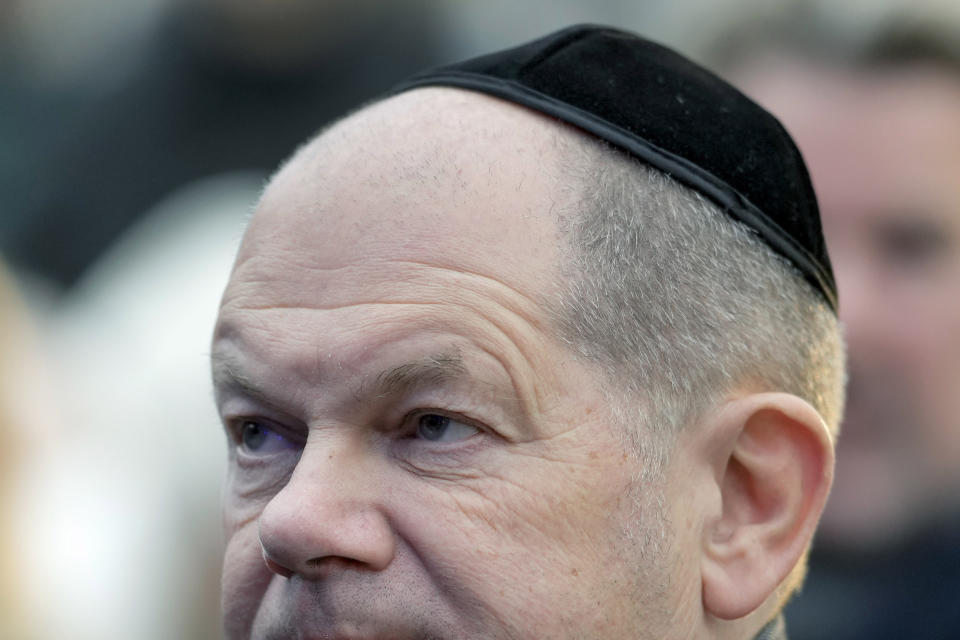 German Chancellor Olaf Scholz attends the ceremony to light the first candle of Hanukkah menorah at Brandenburg Gate in Berlin, Germany, Thursday, Dec. 7, 2023. (AP Photo/Markus Schreiber)