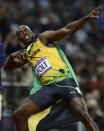 Jamaica's Usain Bolt celebrates after winning the men's 100m final during the London 2012 Olympic Games at the Olympic Stadium August 5, 2012. REUTERS/Dylan Martinez (BRITAIN - Tags: OLYMPICS SPORT ATHLETICS TPX IMAGES OF THE DAY) 