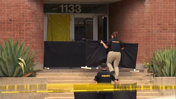 PHOTO: In this screen grab from a video, police work near the scene where a person was killed on the University of Arizona campus in Tucson, Ariz. (KGUN)