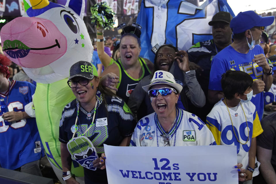 Seattle Seahawks fans cheer during the third day of the NFL draft Saturday, April 30, 2022, in Las Vegas. (AP Photo/John Locher)