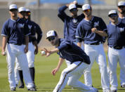 Milwaukee Brewers outfielder Ryan Braun makes a bare hand catch during spring training baseball practice, Monday, Feb. 24, 2014, in Phoenix. (AP Photo/Matt York)