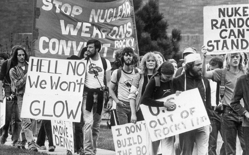 FILE - In this April 28, 1979 file photo, a group of anti-nuclear protesters sets out on a 10-mile hike from Boulder, Colo., to the Rocky Flats nuclear weapons plant, where they joined with more than 7,000 demonstrators at a mass rally seeking closure of the plant. The U.S. Energy Department manufactured plutonium triggers for nuclear warheads at Rocky Flats. It had a long history of leaks, fires and environmental violations. (AP Photo/JE)