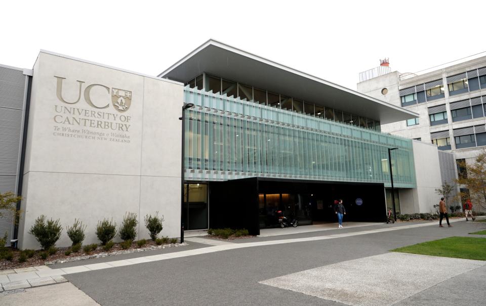 Students leave a building at University of Canterbury in Christchurch, New Zealand, Wednesday, Sept. 25, 2019. New Zealand's education minister called for an investigation Wednesday after reports that a student's body lay undiscovered in a university dorm room for nearly eight weeks.