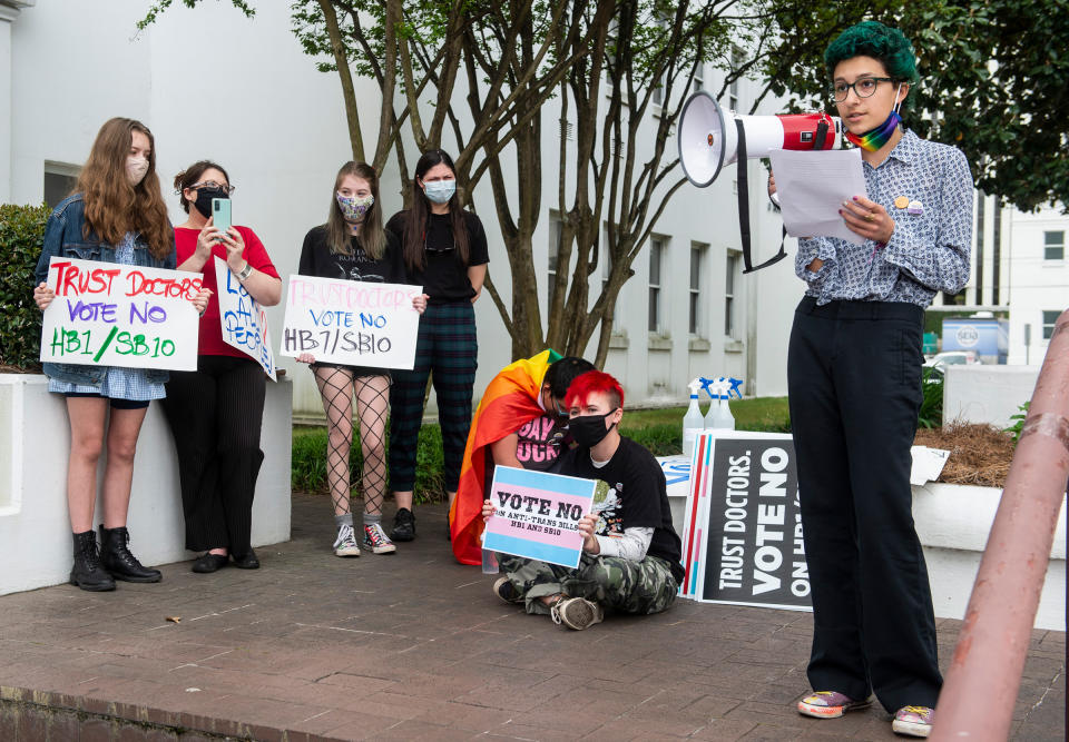 Elijah Baay leads a youth transgender rights rally outside the Alabama State House in Montgomery, Ala., on March 30, 2021.<span class="copyright">Jake Crandall—The Montgomery Advertiser/AP</span>