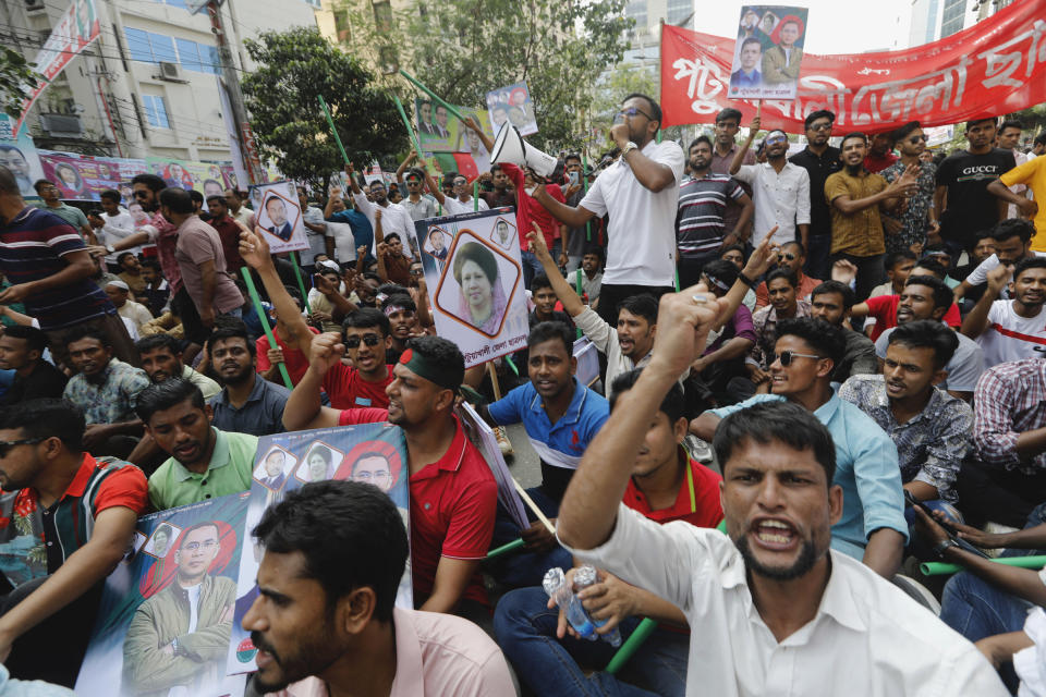 Activists of the Bangladesh Nationalist Party shout slogans during a protest in Dhaka, Bangladesh, Saturday, Oct. 28, 2023. Police in Bangladesh's capital fired tear gas to disperse supporters of the main opposition party who threw stones at security officials during a rally demanding the resignation of Prime Minister Sheikh Hasina and the transfer of power to a non-partisan caretaker government to oversee general elections next year. (AP Photo/Mahmud Hossain Opu)