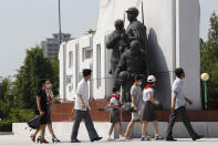 Pyongyang citizens visit the Fatherland Liberation War Martyrs Cemetery in Pyongyang, North Korea, Tuesday, July 27, 2021 to mark the Korean War armistice anniversary. The leaders of North and South Korea restored suspended communication channels between them and agreed to improve ties, both governments said Tuesday, amid a 2 ½ year-stalemate in U.S.-led diplomacy aimed at stripping North Korea of its nuclear weapons. (AP Photo/Jon Chol Jin)