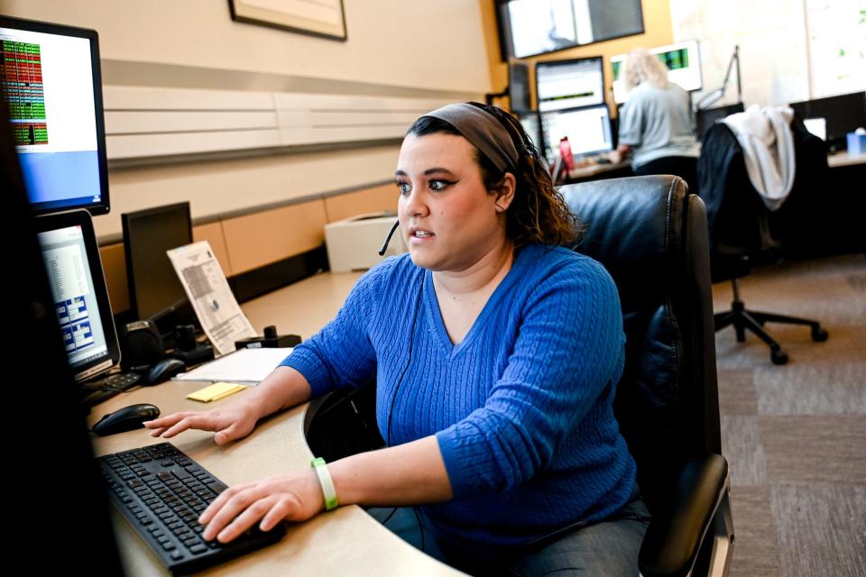 Dispatch Center 911 operator Hayley Hilburn works at Ingham County's 911 Center on Wednesday, April 26, 2023, in Lansing.