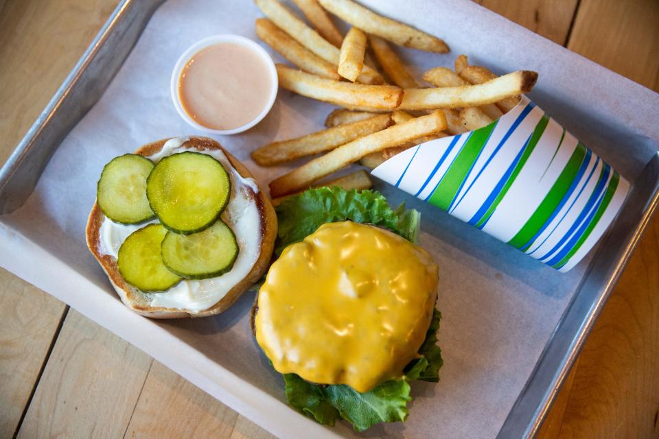 The 300 Burger cheeseburger is made with Angus beef, served on a gourmet bun, with lettuce, tomato, red onion, mayonnaise, house-made pickles and American cheese, with the secret sauce and fries served on the side.