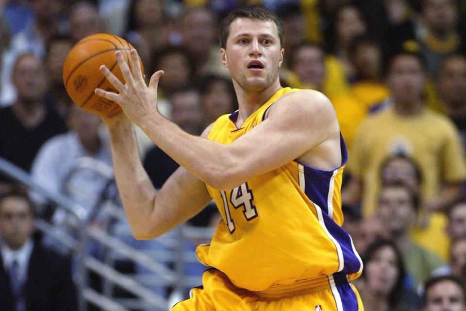 Stanislav Medvedenko #14 of the Los Angeles Lakers passes the ball against the San Antonio Spurs in Game six of the Western Conference Semifinals during the 2004 NBA Playoffs at Staples Center on May 15, 2004 in Los Angeles, California. The Lakers won 88-76 and won the series 4-2.
