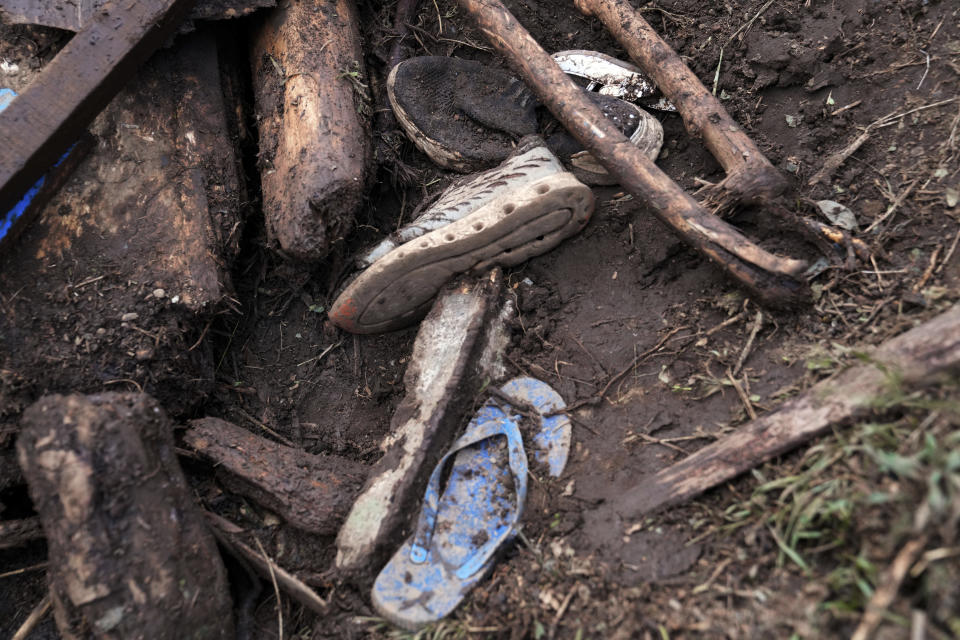 Shoes are seen after floodwater washed away houses and people, in Kamuchiri Village Mai Mahiu, Nakuru County, Kenya, Tuesday, April 30, 2024. Kenya, along with other parts of East Africa, has been overwhelmed by flooding that killed 66 people on Monday alone and in recent days has blocked a national highway, swamped the main airport and swept a bus off a bridge. More than 150,000 people are displaced and living in dozens of camps. (AP Photo/Brian Inganga)