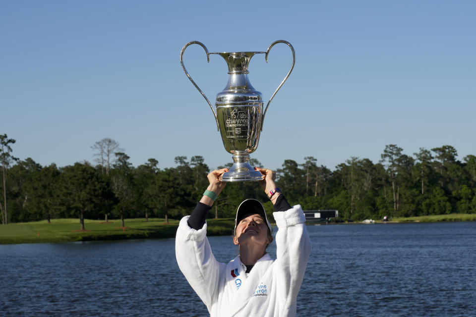 Nelly Korda poses with the trophy after winning the Chevron Championship LPGA golf tournament Sunday, April 21, 2024, at The Club at Carlton Woods in The Woodlands, Texas. (AP Photo/David J. Phillip)