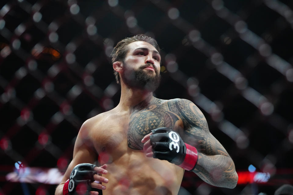 Jul 8, 2023; Las Vegas, Nevada, USA; Kamuela Kirk (red gloves) fights Esteban Robovics (blue gloves) during UFC 290 at T-Mobile Arena. Mandatory Credit: Stephen R. Sylvanie-USA TODAY Sports