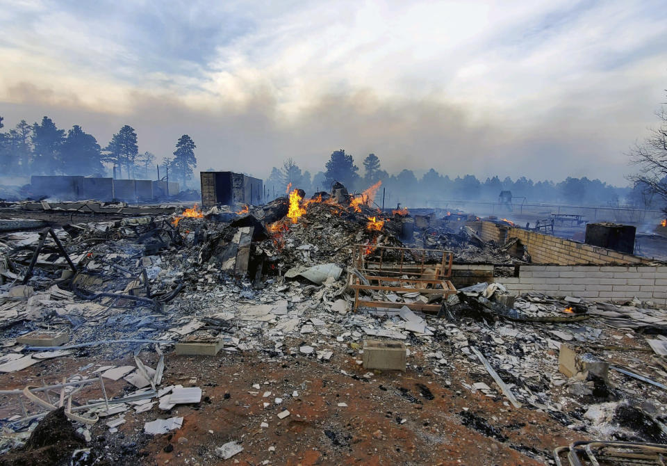 This Wednesday April 20, 2022, photo provided by Bill Wells shows his home on the outskirts of Flagstaff, Ariz., destroyed by a wildfire on Tuesday, April 19, 2022. The wind-whipped wildfire has forced the evacuation of hundreds of homes and animals. (Bill Wells via AP)
