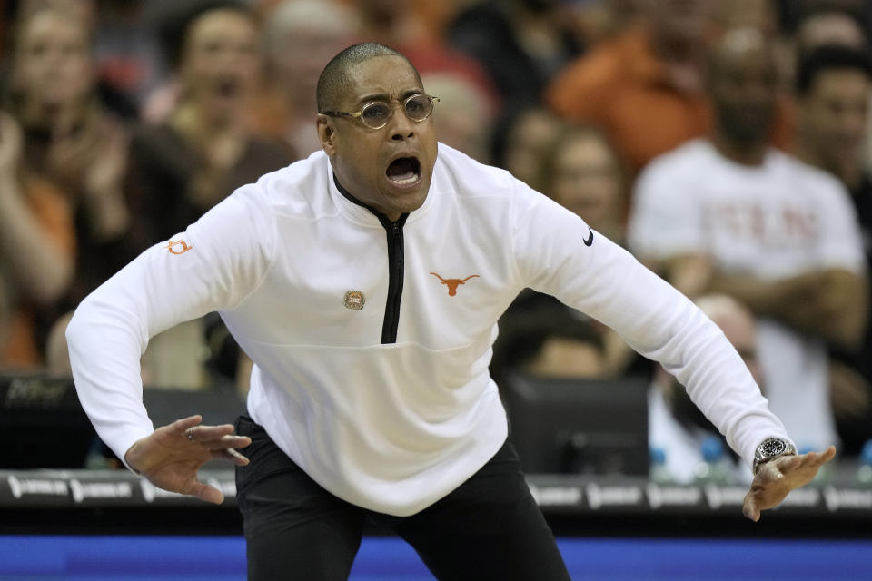 Interim Texas head coach Rodney Terry talks to his team during the second half of the NCAA college basketball championship game against Kansas in the Big 12 Conference tournament Saturday, March 11, 2023, in Kansas City, Mo. (AP Photo/Charlie Riedel)