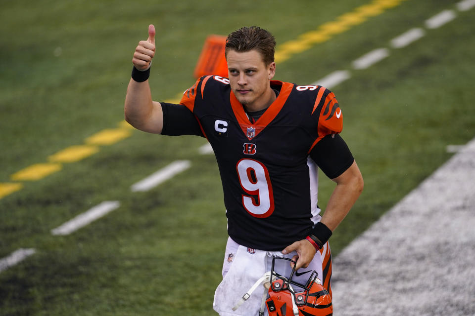 Cincinnati Bengals quarterback Joe Burrow (9) runs off the field following a 33-25 win over the Jacksonville Jaguars in an NFL football game in Cincinnati, Sunday, Oct. 4, 2020. (AP Photo/Bryan Woolston)