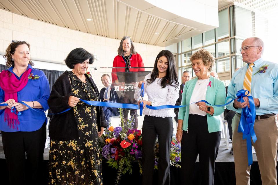 Patricia Cabrera and other current and former cancer patients, including Karen Huntsman, second from right, cofounder of the Huntsman Cancer Institute, cut the ribbon at the opening of the new Kathryn F. Kirk Center for Comprehensive Cancer Care and Women’s Cancers at Huntsman Cancer Institute in Salt Lake City on Monday.