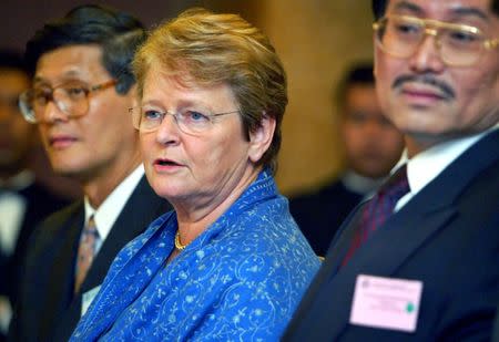 Director General of the World Health Organisation, Dr Gro Harlem Brundtland (C), speaks during a news conference at the WHO's first global conference on SARS in Kuala Lumpur, Malaysia June 17, 2003. REUTERS/Bazuki Muhammad/File Photo