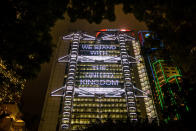 <p>A message in support of the victims of the attack in Manchester that reads “We stand with the United Kingdom” is displayed on the HSBC headquarters building in Hong Kong on May 23, 2017. (Anthony Wallace/AFP/Getty Images) </p>