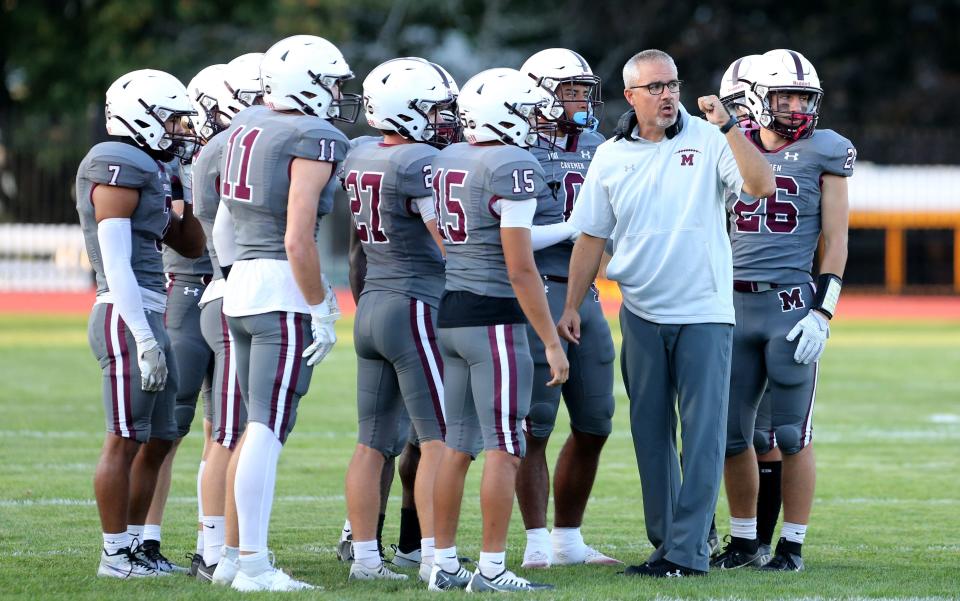 Mishawaka Head Coach Keith Kinder talks to his defensive unit during the Mishawaka vs. Warsaw football game Friday, Sept. 22, 2023, at Steele Stadium in Mishawaka.