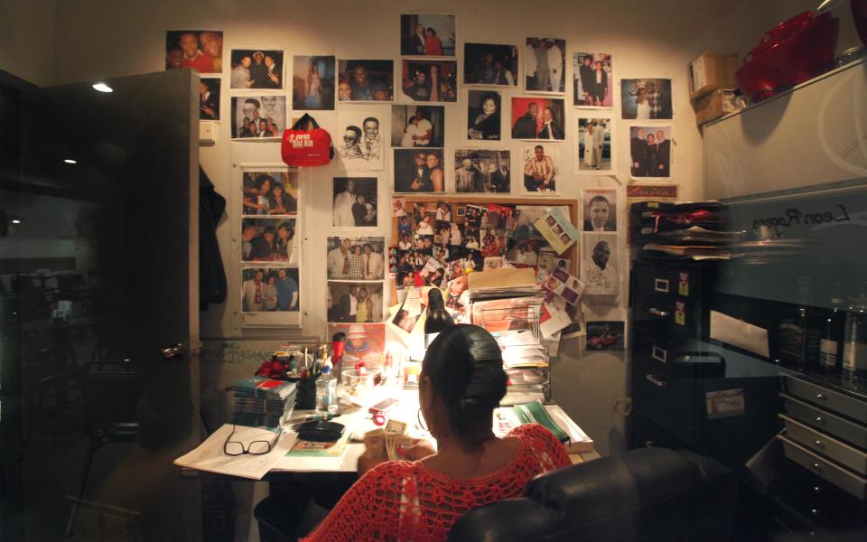 In this June 8, 2012 photo, comedy club owner Mary Lindsey prepares for the evening in her office at the Jokes and Notes comedy club in Chicago's Bronzeville neighborhood. African-American female club owners are a rarity in the industry of comedy, but Lindsey is breaking barriers and uplifting a community by providing a place where raw comedic talent can hone their skills. (AP Photo/Charles Rex Arbogast)