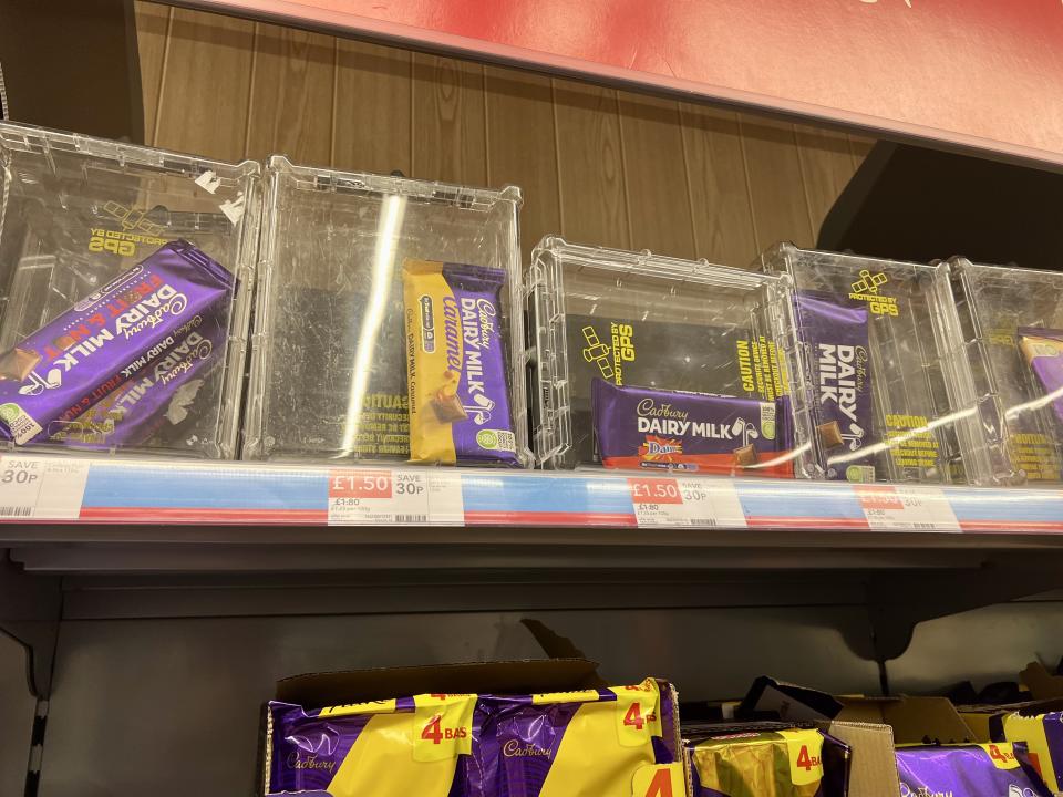 Jack Johnston posted a photo of the Cadbury's chocolates locked up in an anti-theft cases that he spotted at a Co-operative on Milton Road in Cambridge.