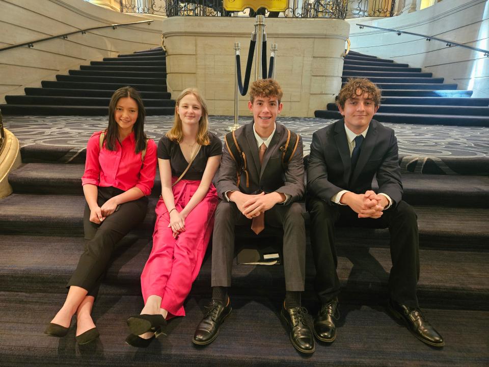 Sanford-Fritch High School students on the stairs at BPA National Leadership Conference - The Hilton Chicago: Administrative Support Team Left to Right: Zoe Deatherage, Daley Ringo, Benjamin Silvey, and Jadon DeRaad.