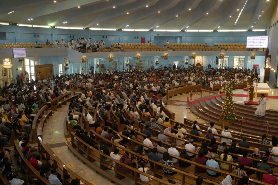 People take part in a liturgy at the Catholic Church, Our Lady of the Rosary, at the Religious complex, in Doha, Qatar, Friday, Dec. 9, 2022. (AP Photo/Thanassis Stavrakis)