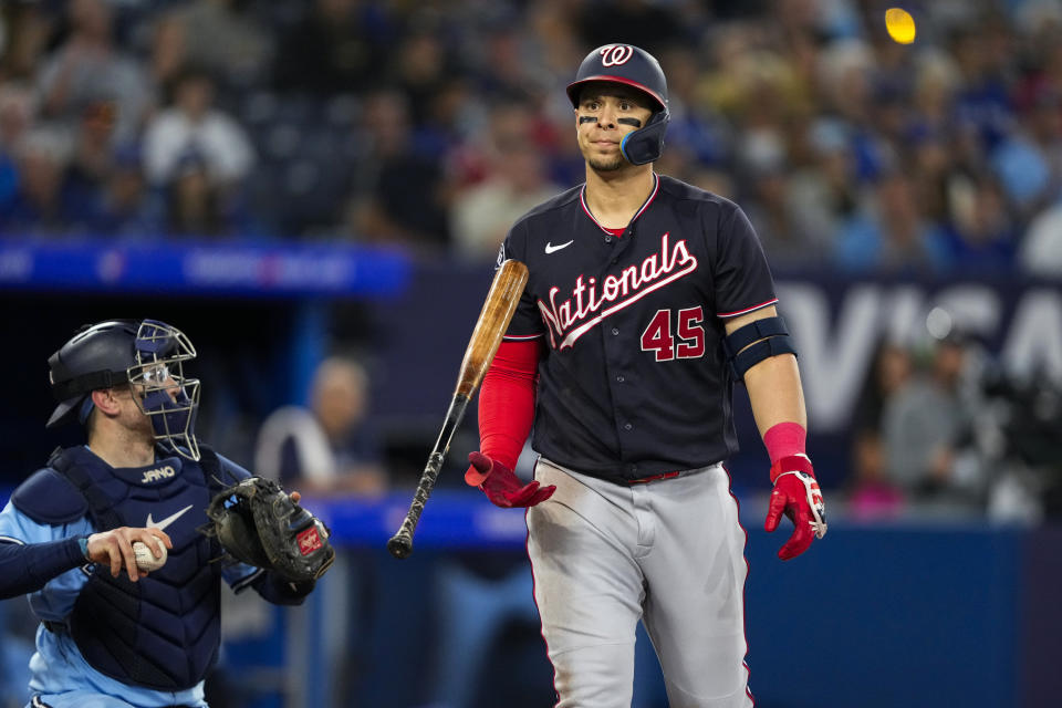 Washington Nationals designated hitter Joey Meneses (45) reacts after striking out during the third inning of a baseball game against the Toronto Blue Jays in Toronto on Monday, Aug. 28, 2023. (Andrew Lahodynskyj/The Canadian Press via AP)