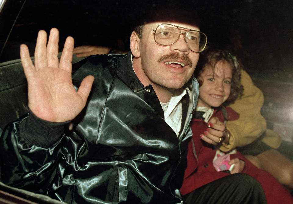 FILE - Terry Anderson, who was the longest held American hostage in Lebanon, grins with his 6-year-old daughter Sulome, Dec. 4, 1991, as they leave the U.S. Ambassador's residence in Damascus, Syria, following Anderson's release. Anderson, the globe-trotting Associated Press correspondent who became one of America’s longest-held hostages after he was snatched from a street in war-torn Lebanon in 1985 and held for nearly seven years, died Sunday, April 21, 2024. He was 76. (AP Photo/Santiago Lyon, File)