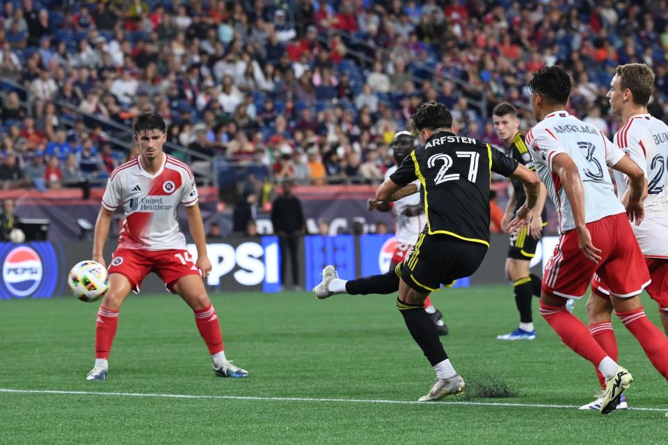 Jun 29, 2024; Foxborough, Massachusetts, USA; Columbus Crew forward Max Arftsen (27) scores a goal against the New England Revolution during the first half at Gillette Stadium. Mandatory Credit: Eric Canha-USA TODAY Sports