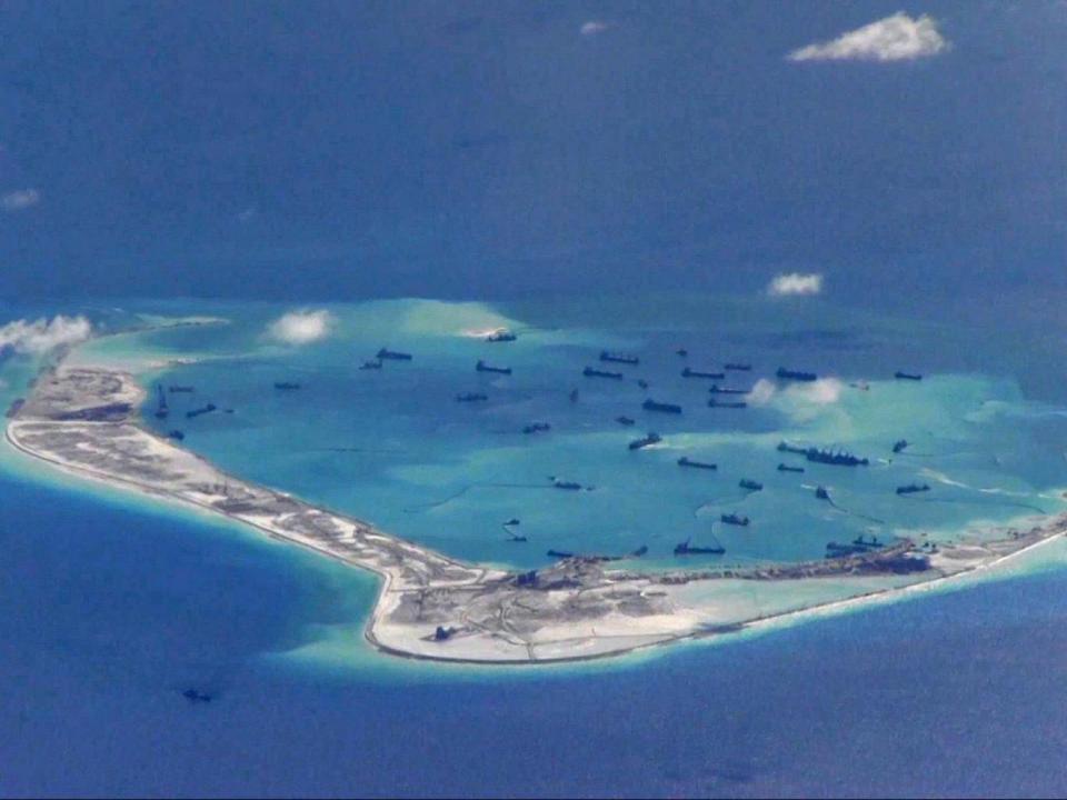 Chinese dredging vessels are purportedly seen in the waters around Mischief Reef, in an image taken by an American P-8A Poseidon surveillance aircraft (REUTERS)